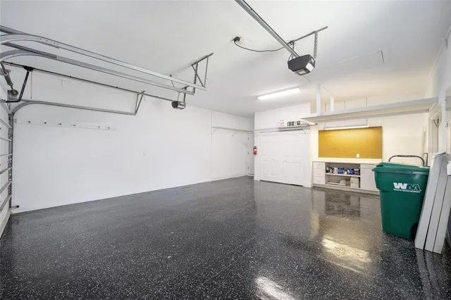 a view of a room with wooden floor and windows