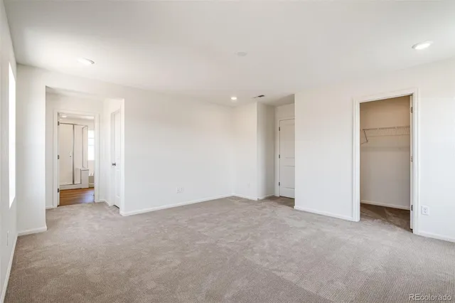 a spacious bathroom with a tub sink shower and mirror