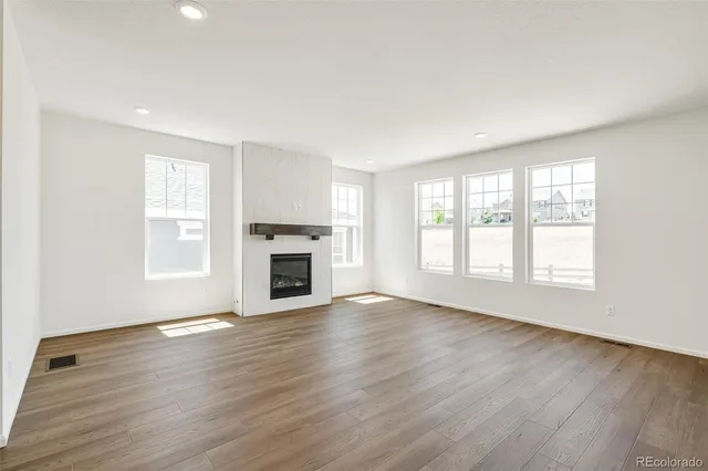 a kitchen with stainless steel appliances a sink stove refrigerator and cabinets