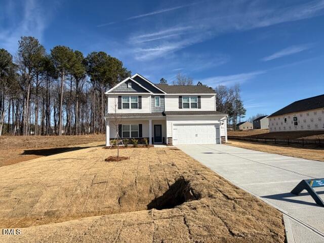 64 Foxton Place Angier, NC 27501 - Photo 2 of 26 a front view of a house with a yard