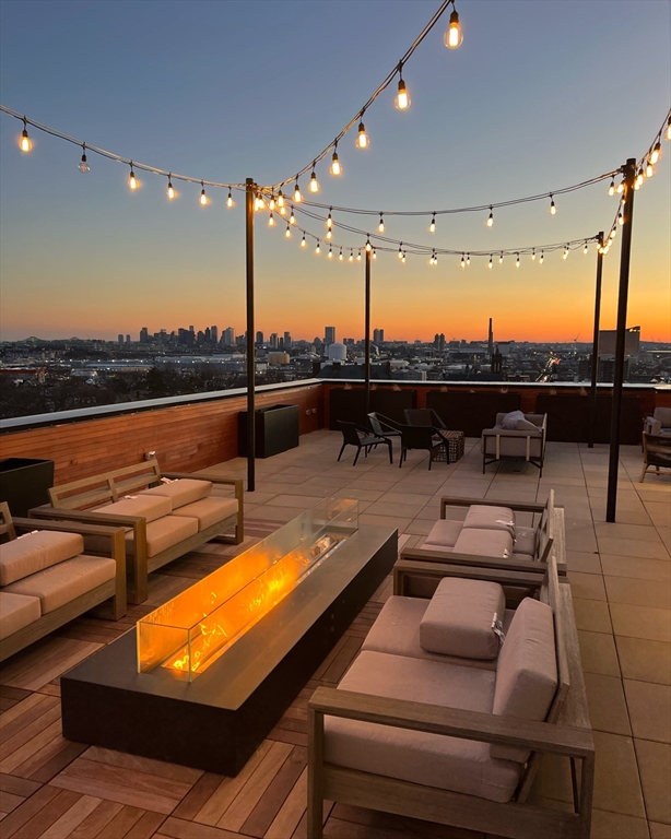 600 Broadway, Unit 616 Chelsea, MA 02150 - Photo 20 of 25 a outdoor sitting area with furniture and a ocean view