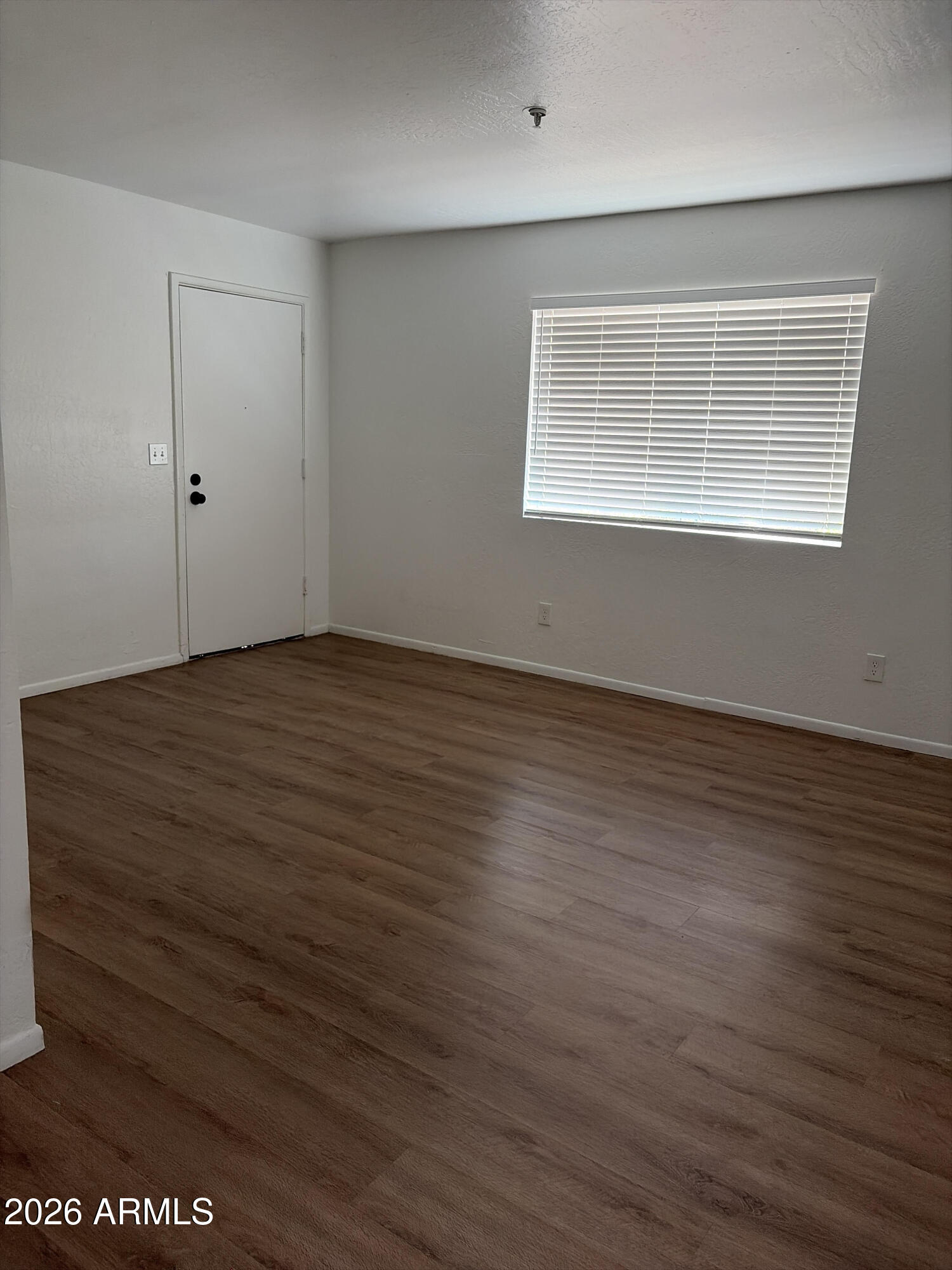12123 West Bell Road, Unit 125 Surprise, AZ 85378 - Photo 37 of 39 Living room towards entry