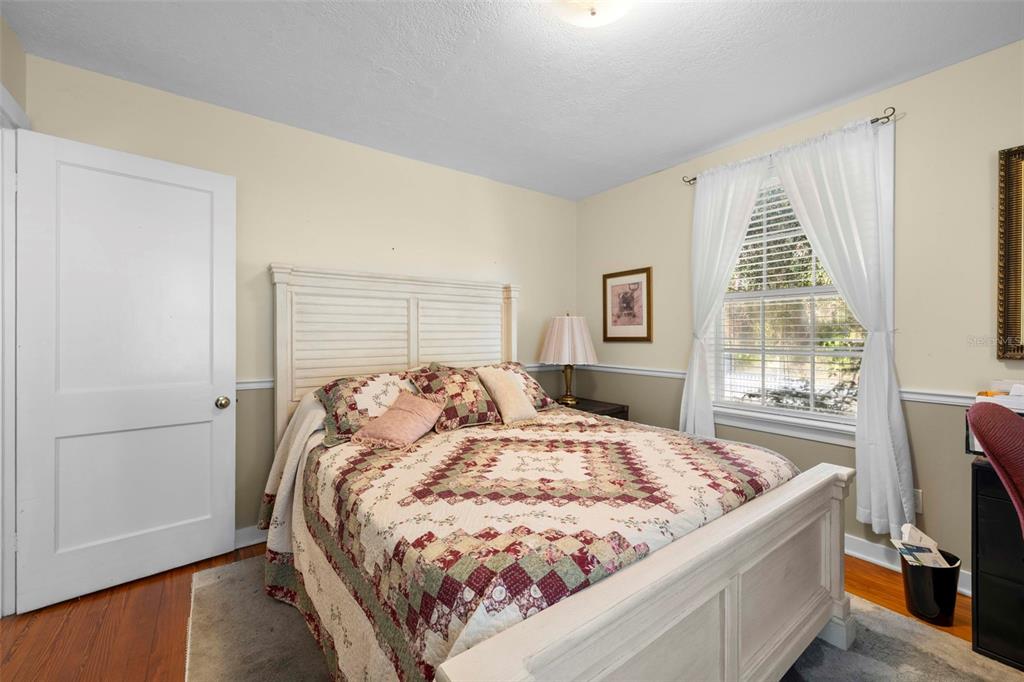 16 52nd Street Yankeetown, FL 34498 - Photo 35 of 63 a bed sitting in a bedroom next to a window