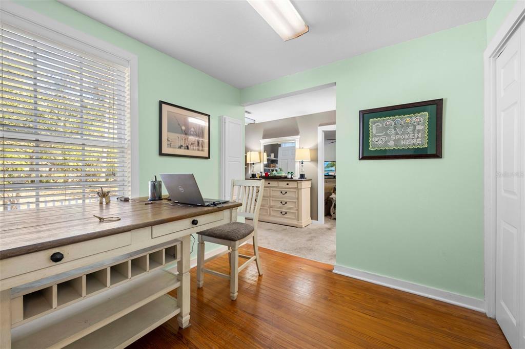 16 52nd Street Yankeetown, FL 34498 - Photo 41 of 63 a living room with stainless steel appliances kitchen island granite countertop a refrigerator stove and wooden floor