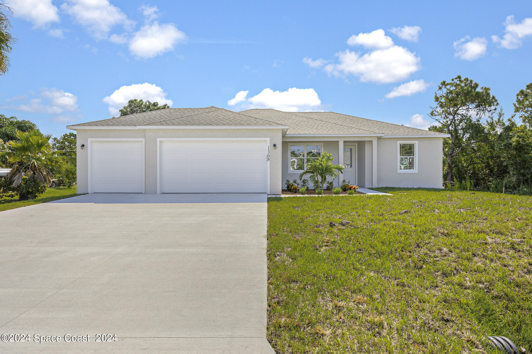 1368 Rabbit Street Southeast Palm Bay, FL 32909 - Photo 3 of 31 a front view of house with yard