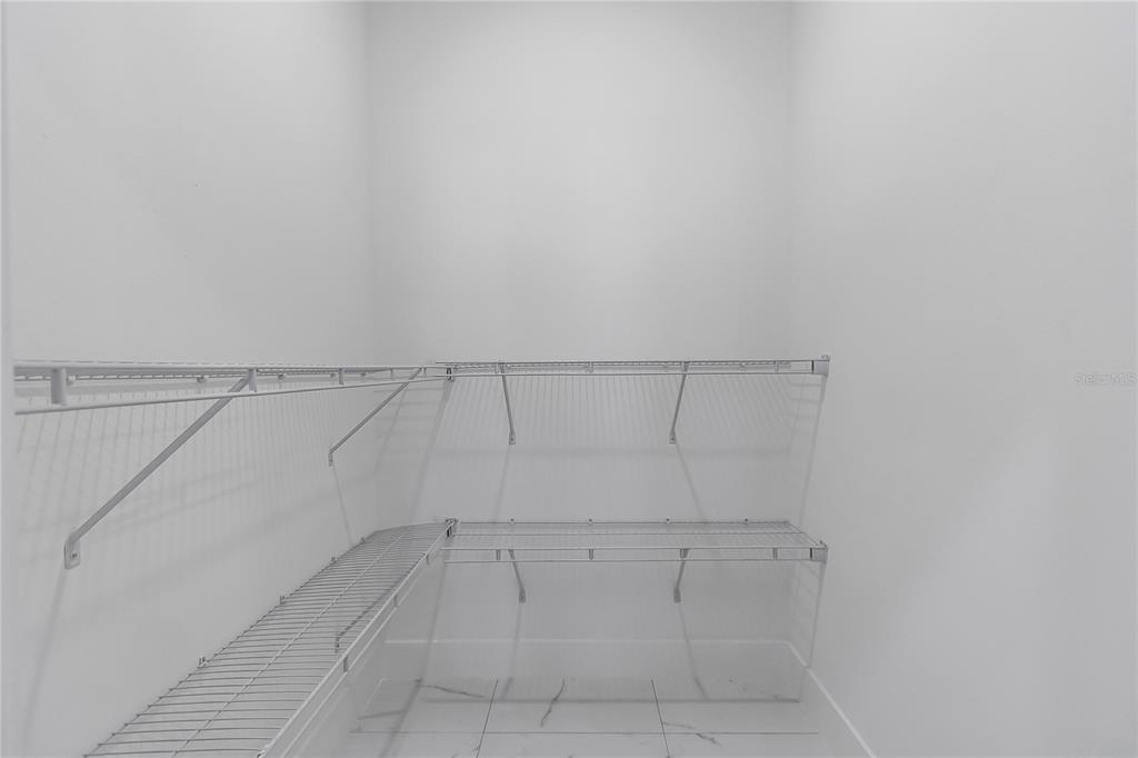 15070 Southwest 21st Ter Road Ocala, FL 34473 - Photo 17 of 47 a view of a room with racks on the wall