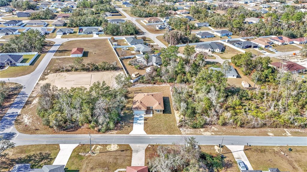15070 Southwest 21st Ter Road Ocala, FL 34473 - Photo 23 of 47 an aerial view of residential houses with yard