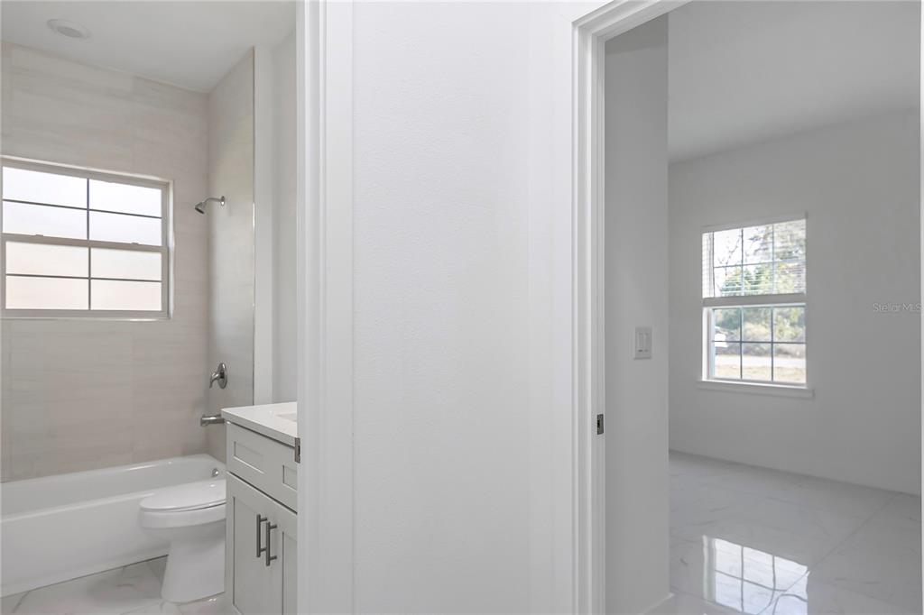 15070 Southwest 21st Ter Road Ocala, FL 34473 - Photo 27 of 47 a bathroom with a toilet a sink and a bathtub