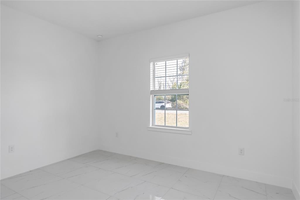 15070 Southwest 21st Ter Road Ocala, FL 34473 - Photo 28 of 47 an empty room with a window