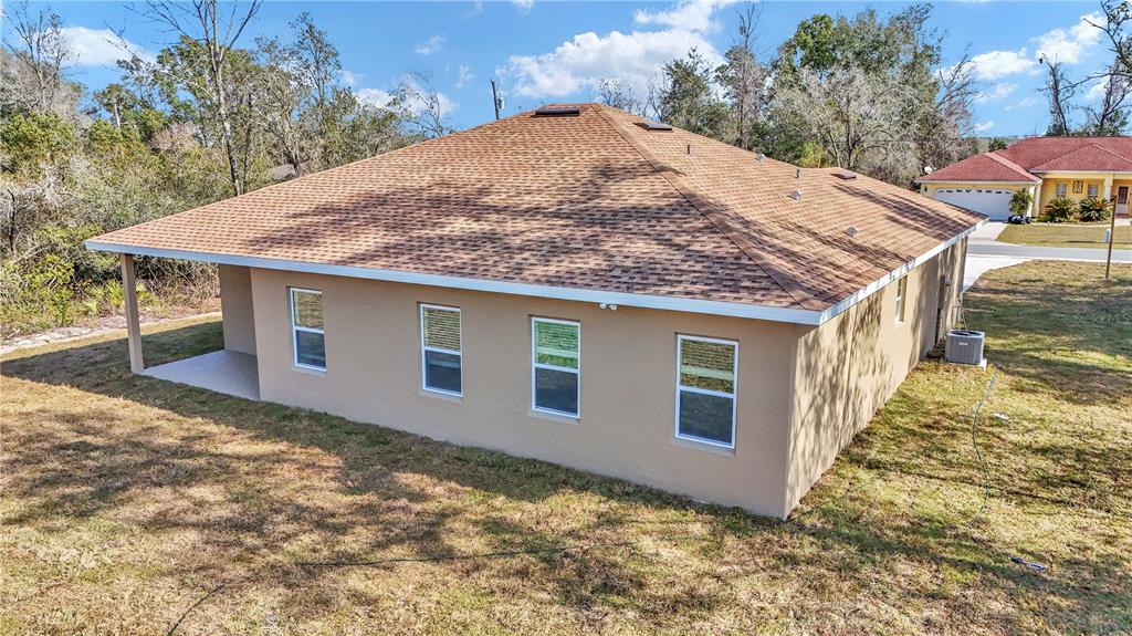 15070 Southwest 21st Ter Road Ocala, FL 34473 - Photo 3 of 47 a view of a house with a yard