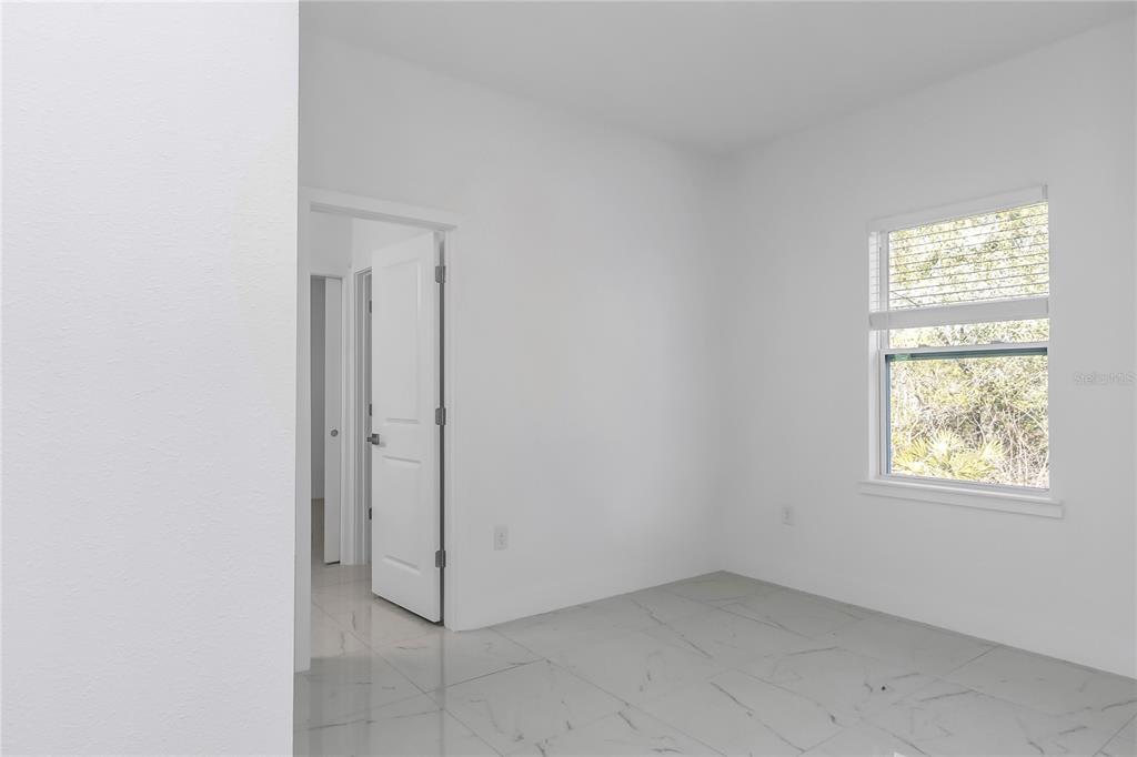 15070 Southwest 21st Ter Road Ocala, FL 34473 - Photo 31 of 47 an empty room with windows and closet