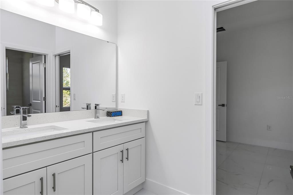 15070 Southwest 21st Ter Road Ocala, FL 34473 - Photo 33 of 47 a bathroom with a sink and a mirror