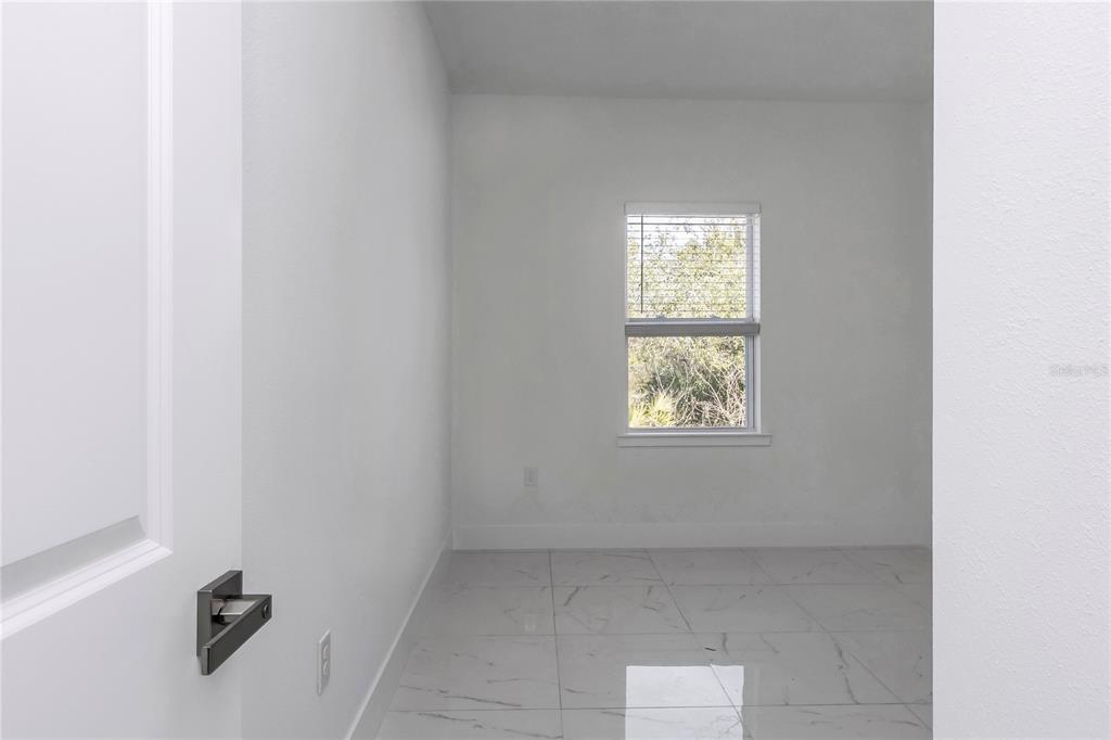 15070 Southwest 21st Ter Road Ocala, FL 34473 - Photo 37 of 47 a view of an empty room with a window