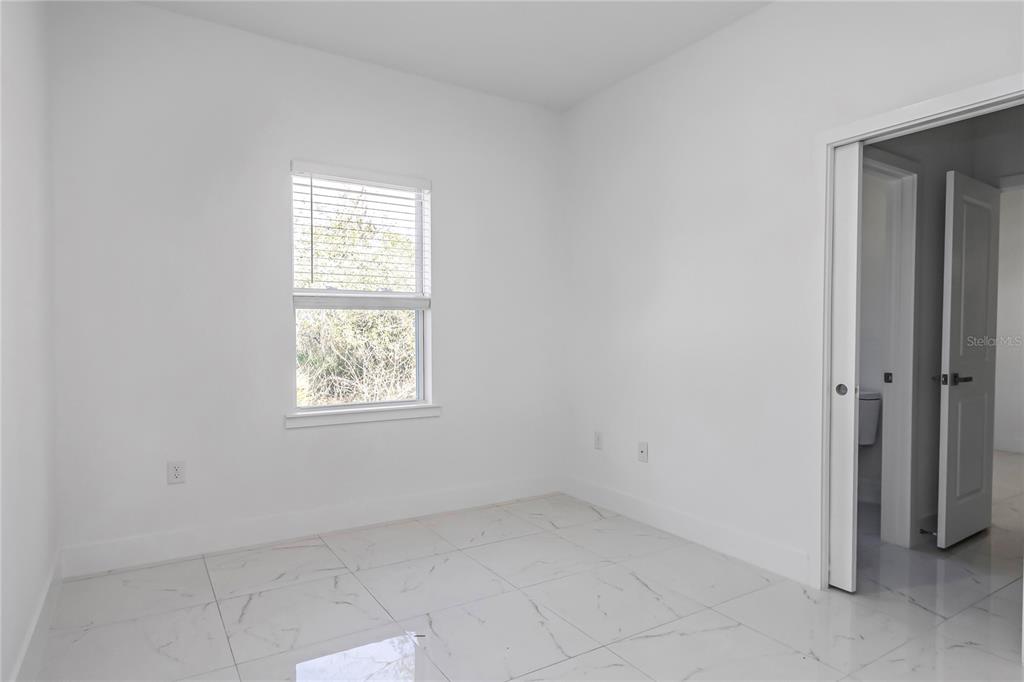 15070 Southwest 21st Ter Road Ocala, FL 34473 - Photo 38 of 47 an empty room with a window