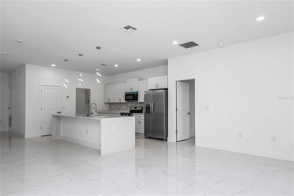 15070 Southwest 21st Ter Road Ocala, FL 34473 - Photo 39 of 47 a kitchen with a refrigerator and a sink