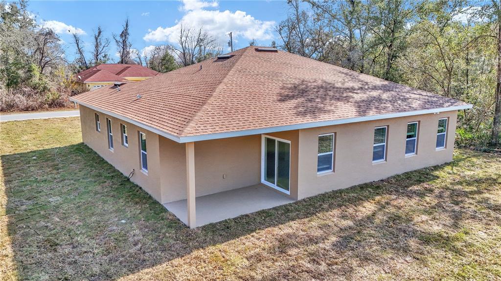 15070 Southwest 21st Ter Road Ocala, FL 34473 - Photo 4 of 47 a view of a house with a yard
