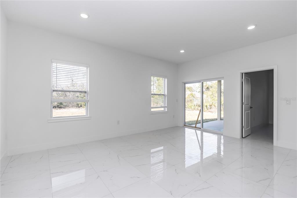 15070 Southwest 21st Ter Road Ocala, FL 34473 - Photo 8 of 47 a view of an empty room with a window