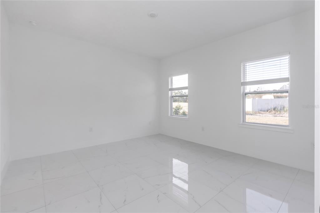 15070 Southwest 21st Ter Road Ocala, FL 34473 - Photo 9 of 47 an empty room with windows