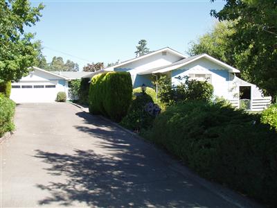 8314 Elphick Road Sebastopol, CA 95472 - Photo 10 of 10 a view of a house with a small yard and plants