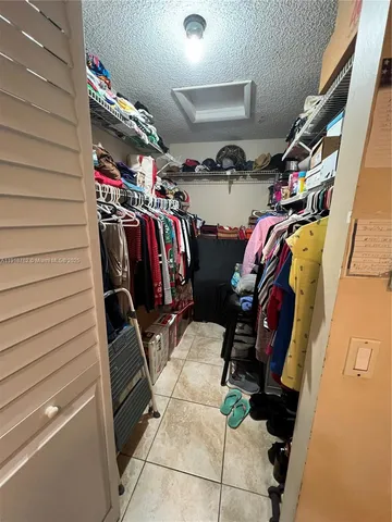 a view of a chairs and table in patio