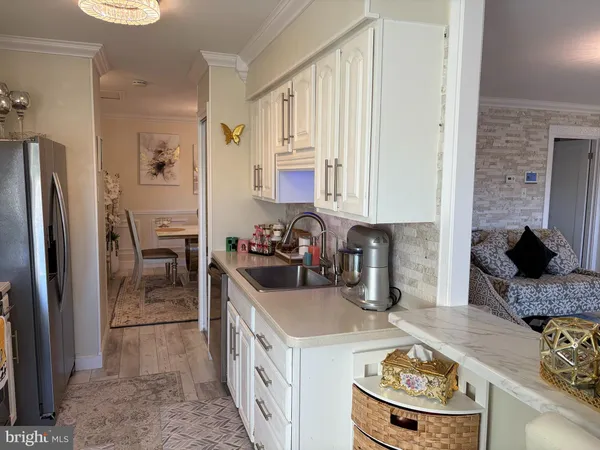 a kitchen with stainless steel appliances granite countertop a stove and a refrigerator