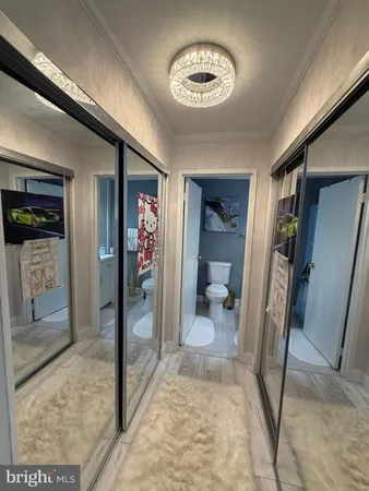 a view of a hallway with a livingroom view