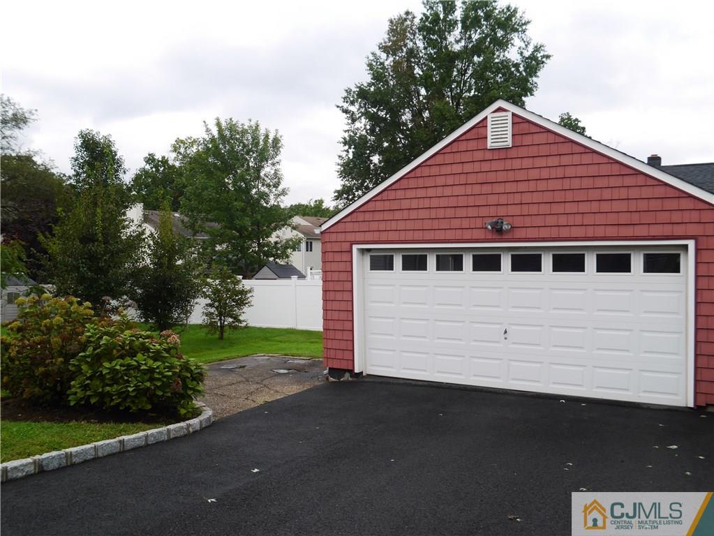544 Chain O' Hills Road Colonia, NJ 07067 - Photo 2 of 5 a front view of a house with a yard