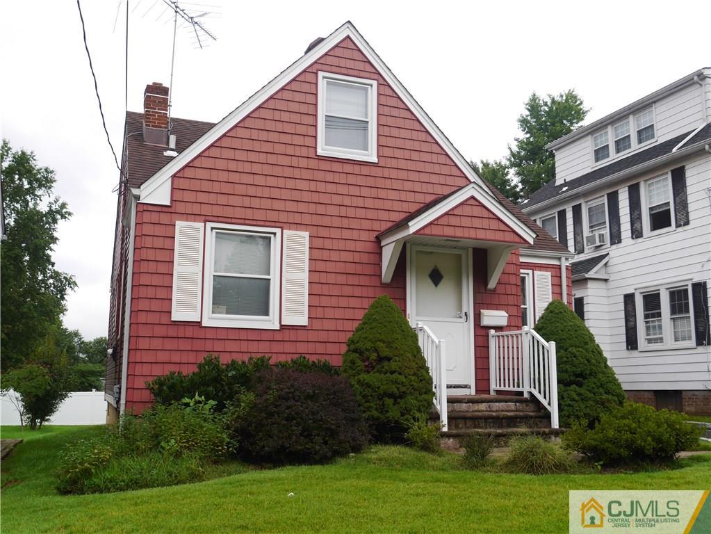 544 Chain O' Hills Road Colonia, NJ 07067 - Photo 3 of 5 a front view of a house with a yard