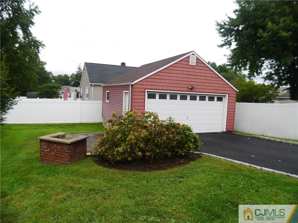 544 Chain O' Hills Road Colonia, NJ 07067 - Photo 5 of 5 a view of a house with a garden
