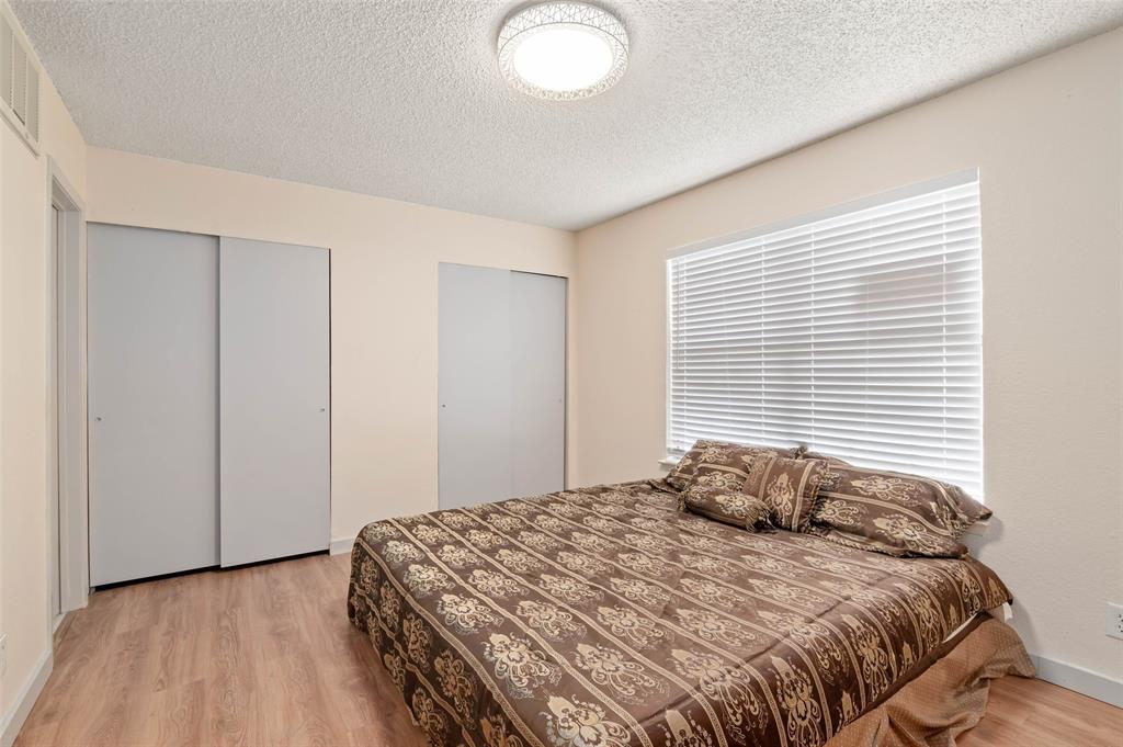 700 West Collins Street Denton, TX 76201 - Photo 20 of 36 Primary bedroom with ensuite bath