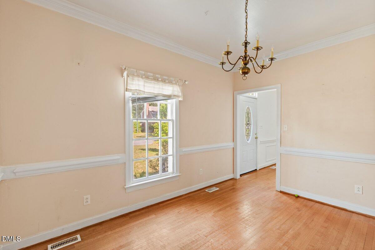 3812 Providence Road Rocky Mount, NC 27803 - Photo 5 of 18 a view of an empty room with a window