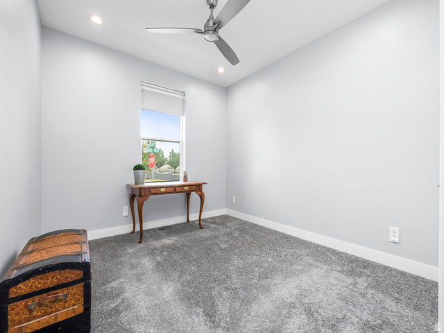 877 South Yarrow Drive Mapleton, UT 84664 - Photo 14 of 46 Light gray wall paint complemented by white trim and plush gray carpeting