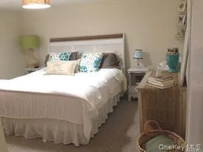 a bedroom with bed and window