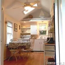 a kitchen with a sink appliances and cabinets