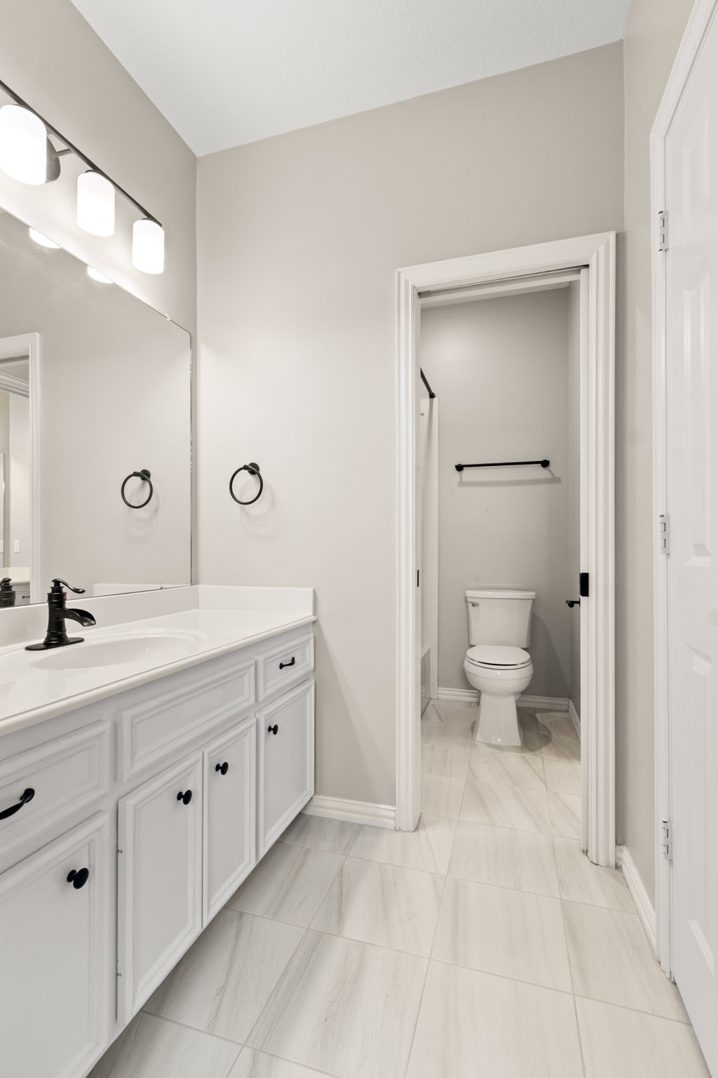 5803 Desert Oak Way Spring, TX 77379 - Photo 35 of 50 New modern tile in both secondary bathrooms and vanity areas.