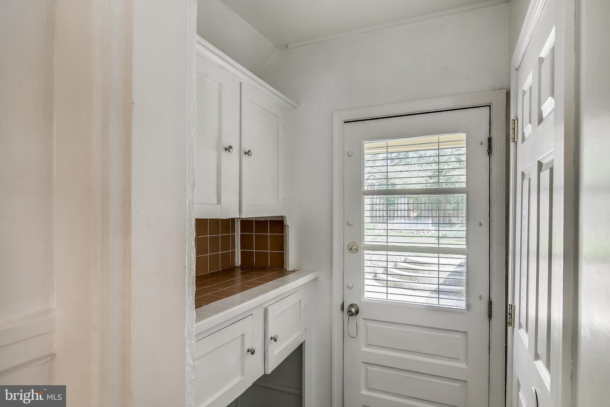 702 Wayne Avenue Silver Spring, MD 20910 - Photo 15 of 41 Rear entry/mud room with cabinets and PR