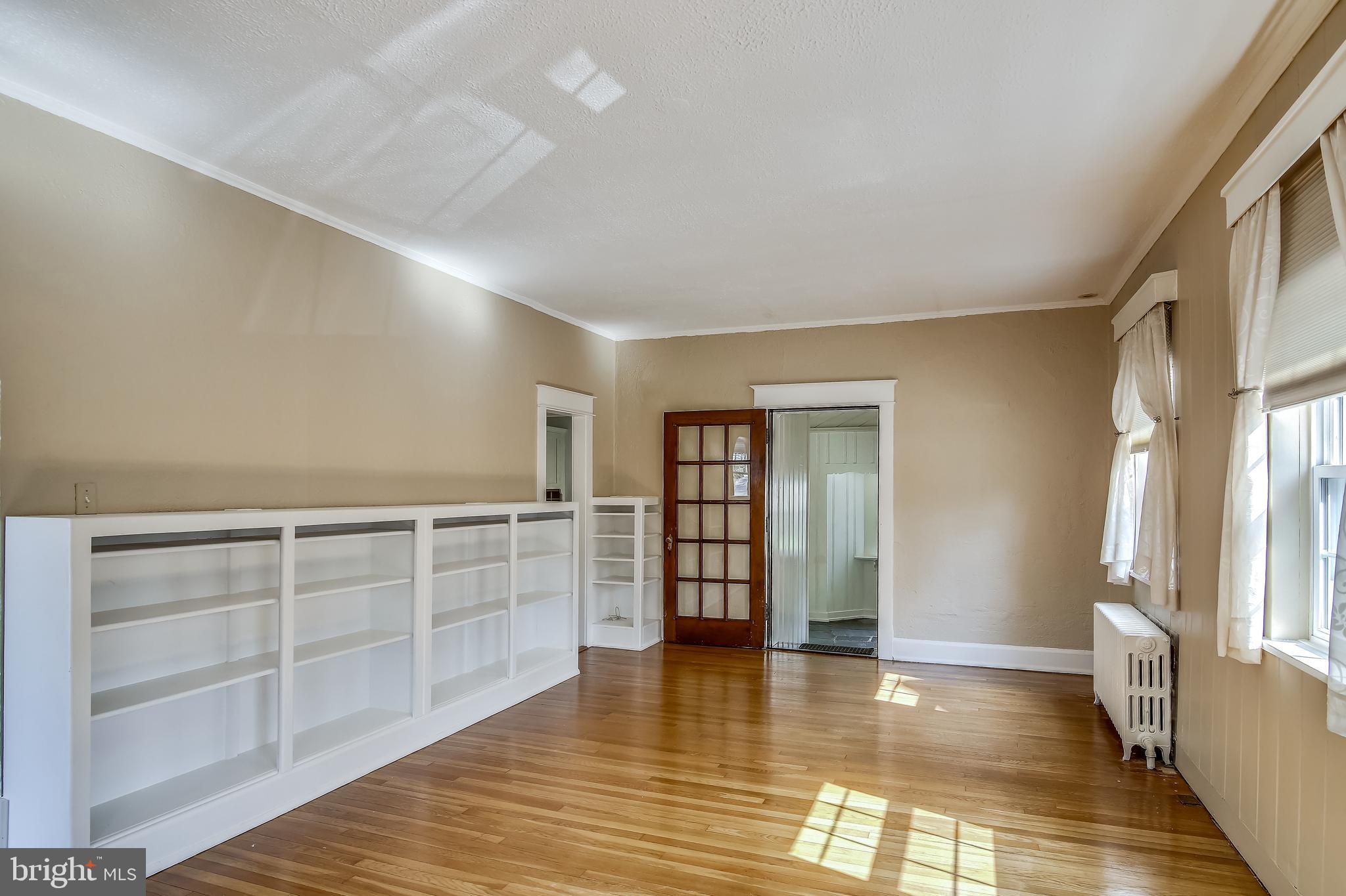 702 Wayne Avenue Silver Spring, MD 20910 - Photo 6 of 41 Living room with built in bookcases