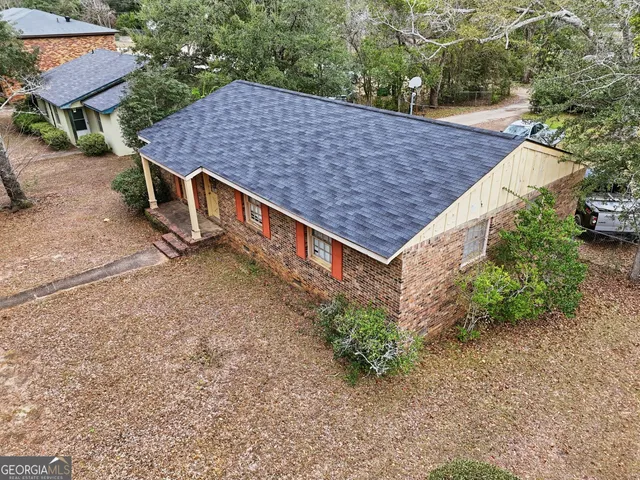 a aerial view of a house with a yard