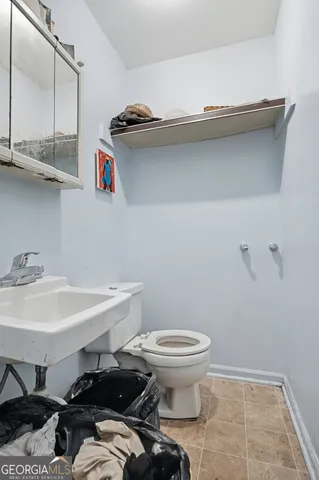 a bathroom with a sink and a toilet