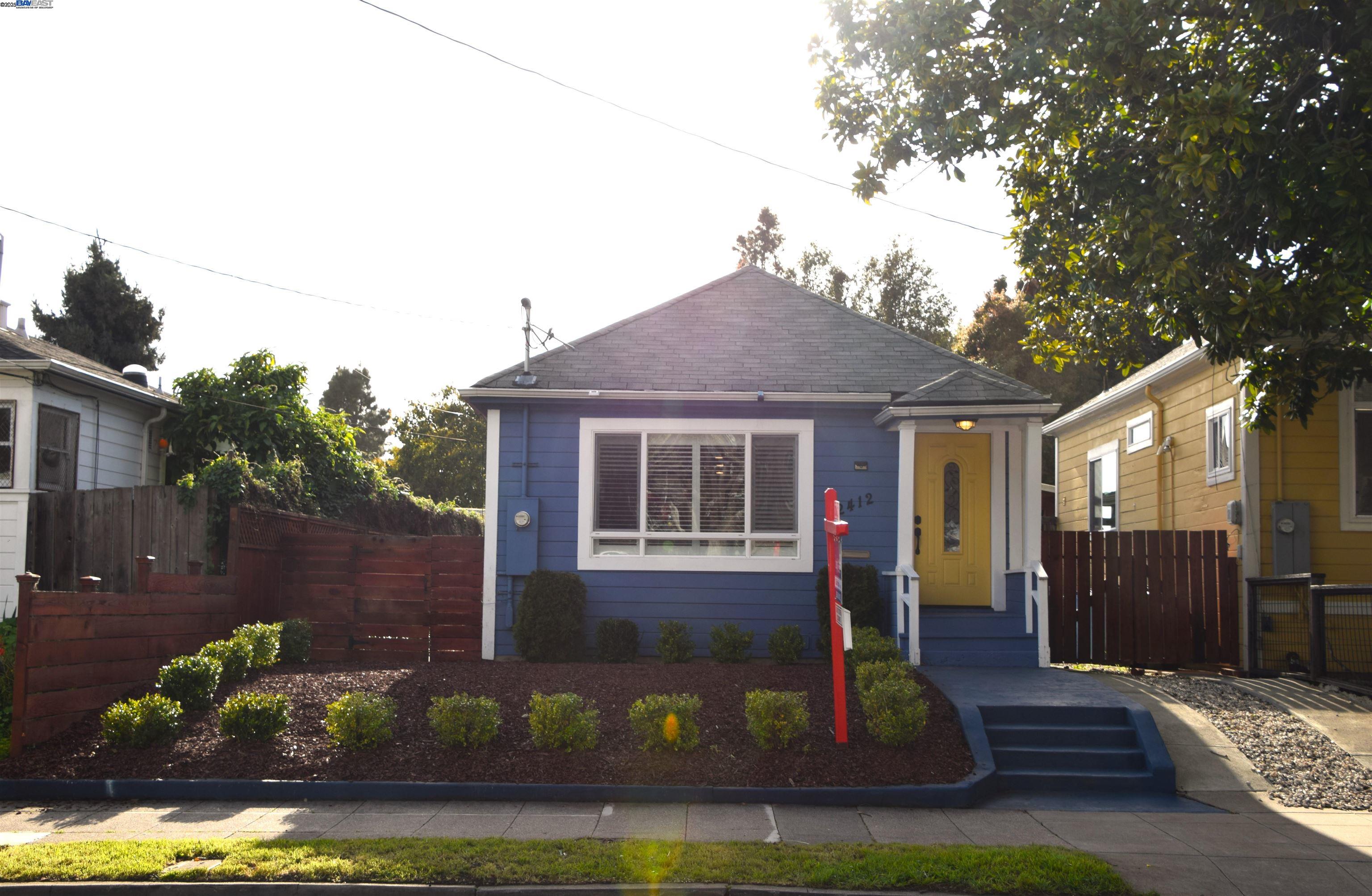 2412 Eighth Street Berkeley, CA 94710 - Photo 1 of 1 a front view of a house with a yard