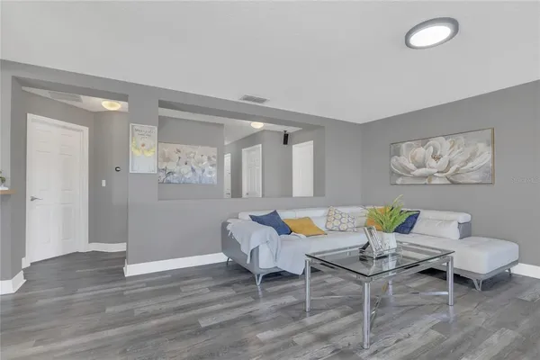 a living room with furniture and windows