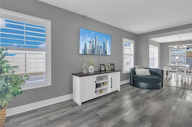 a dining room with furniture and window