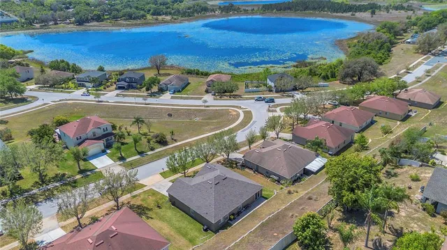 an aerial view of residential houses and outdoor space