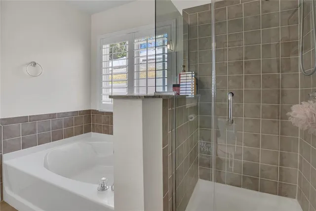 a bathroom with a granite countertop sink a toilet and a mirror