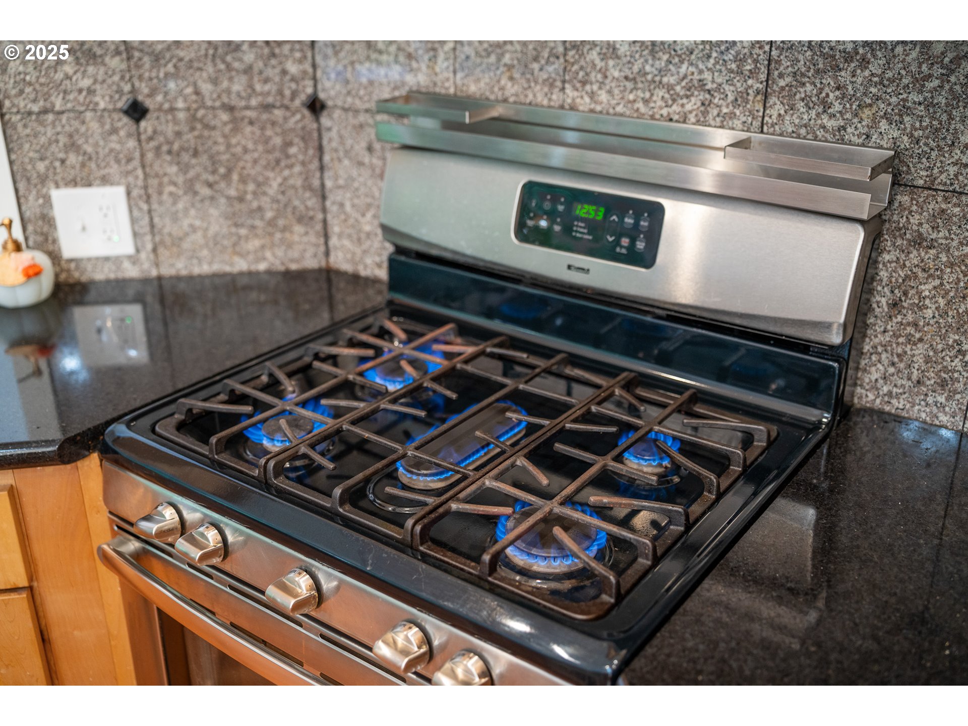3308 Bayview Terrace Seaside, OR 97138 - Photo 11 of 48 a stove top oven sitting inside of a kitchen