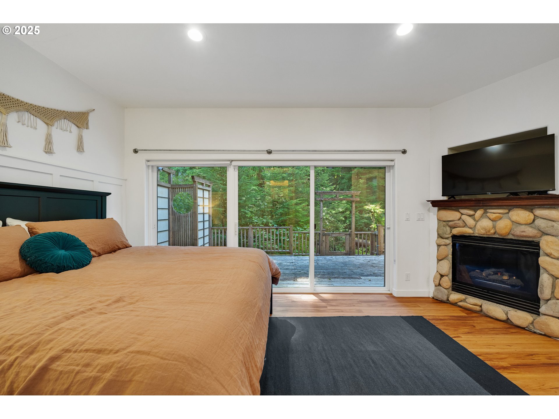 3308 Bayview Terrace Seaside, OR 97138 - Photo 17 of 48 a bedroom with a bed and a fireplace