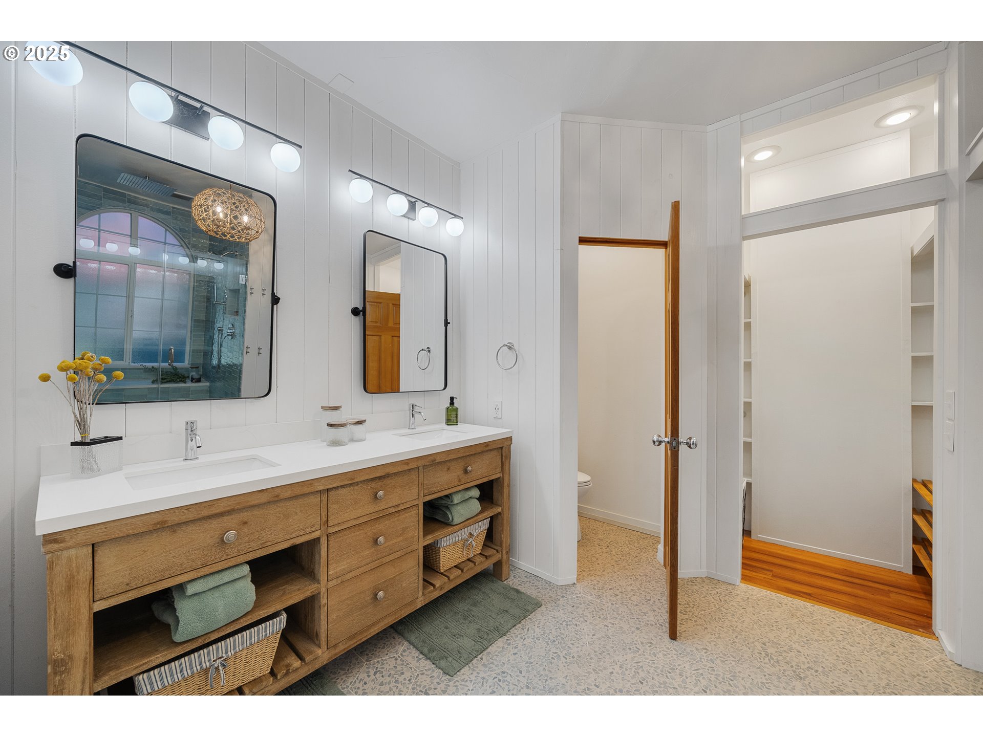 3308 Bayview Terrace Seaside, OR 97138 - Photo 18 of 48 a bathroom with a double vanity sink and mirror