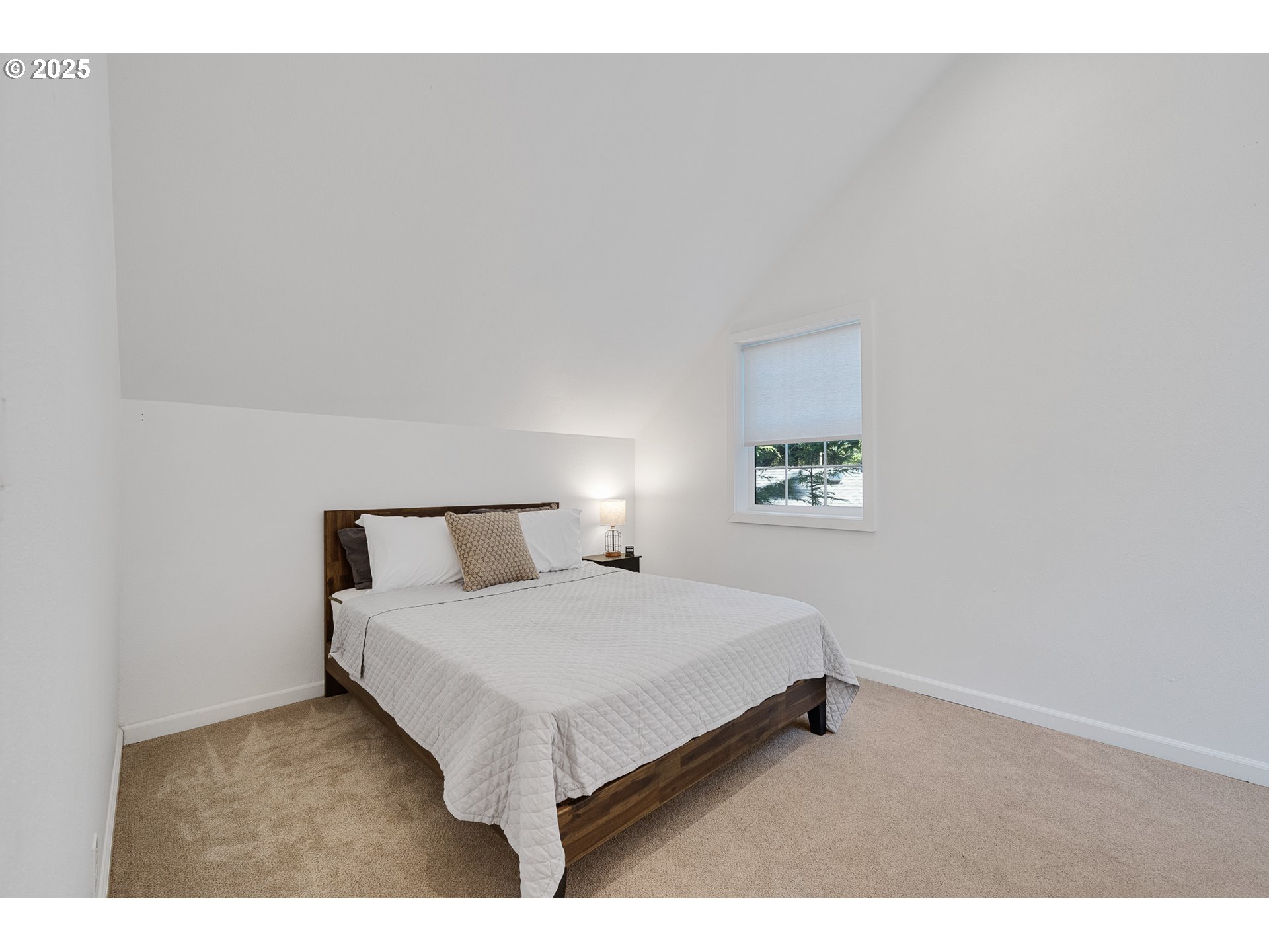 3308 Bayview Terrace Seaside, OR 97138 - Photo 29 of 48 a bedroom with a bed and a night stand