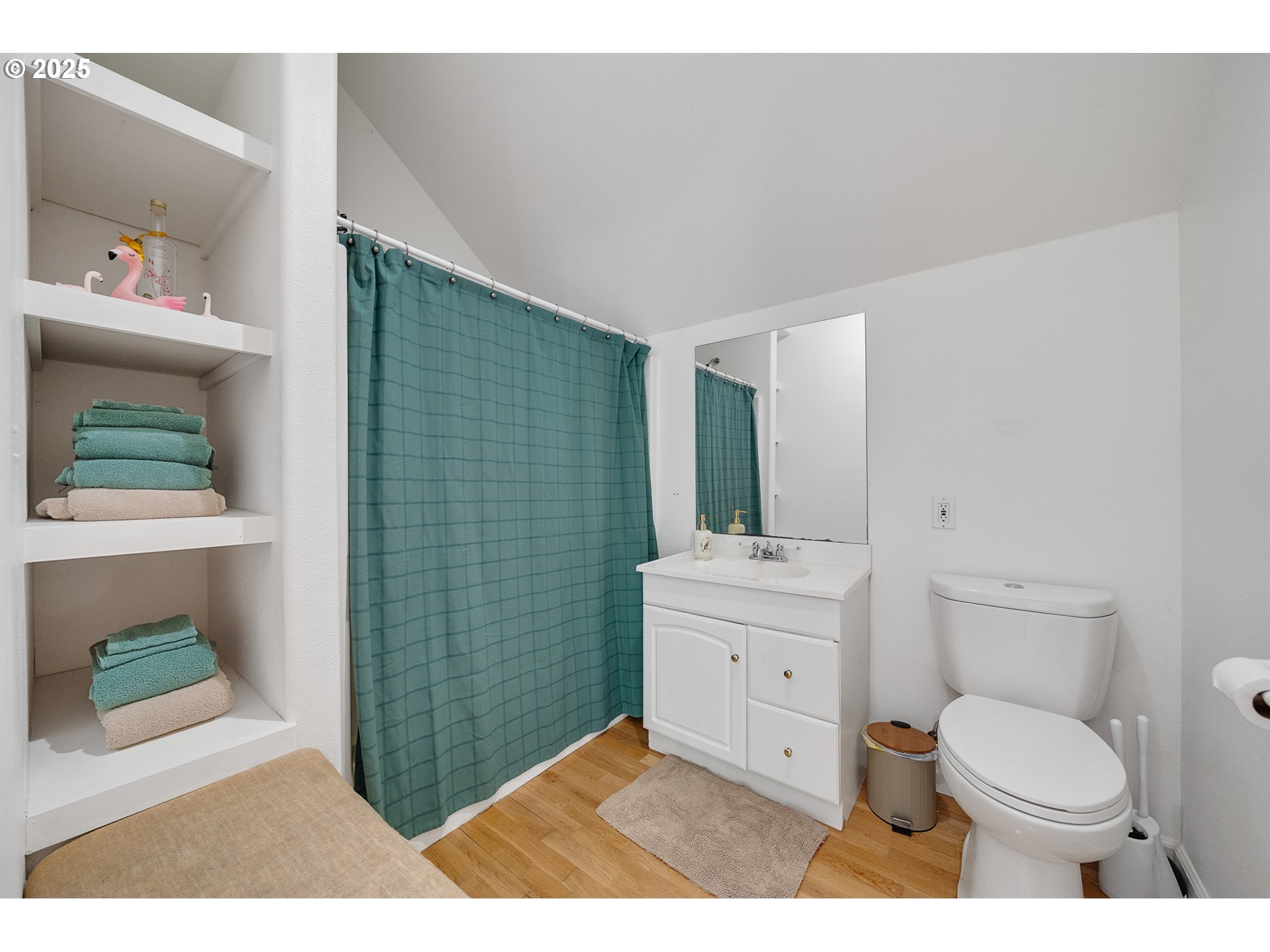 3308 Bayview Terrace Seaside, OR 97138 - Photo 31 of 48 a bathroom with a toilet a sink and mirror