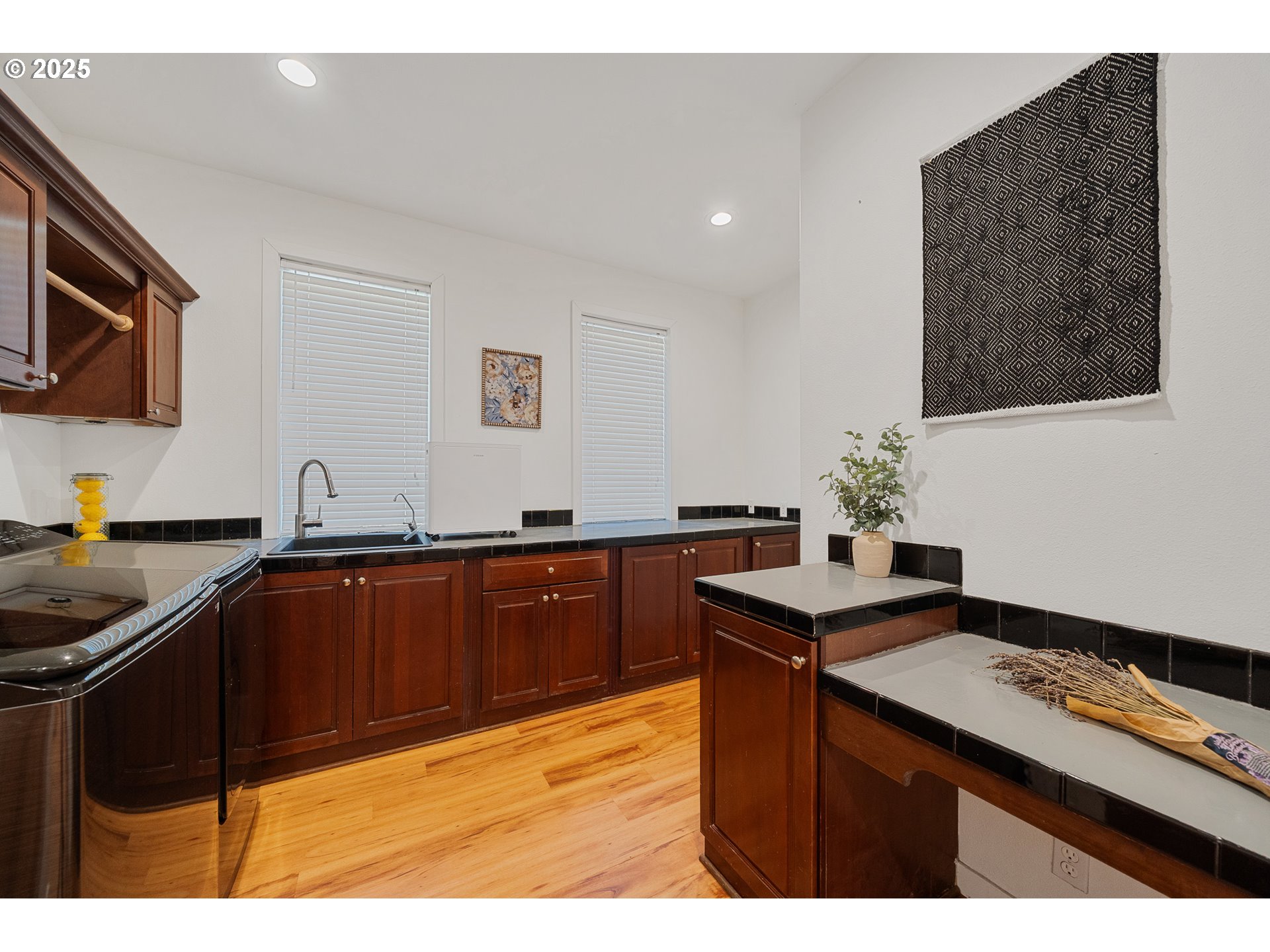 3308 Bayview Terrace Seaside, OR 97138 - Photo 35 of 48 a kitchen with granite countertop a sink stove and microwave